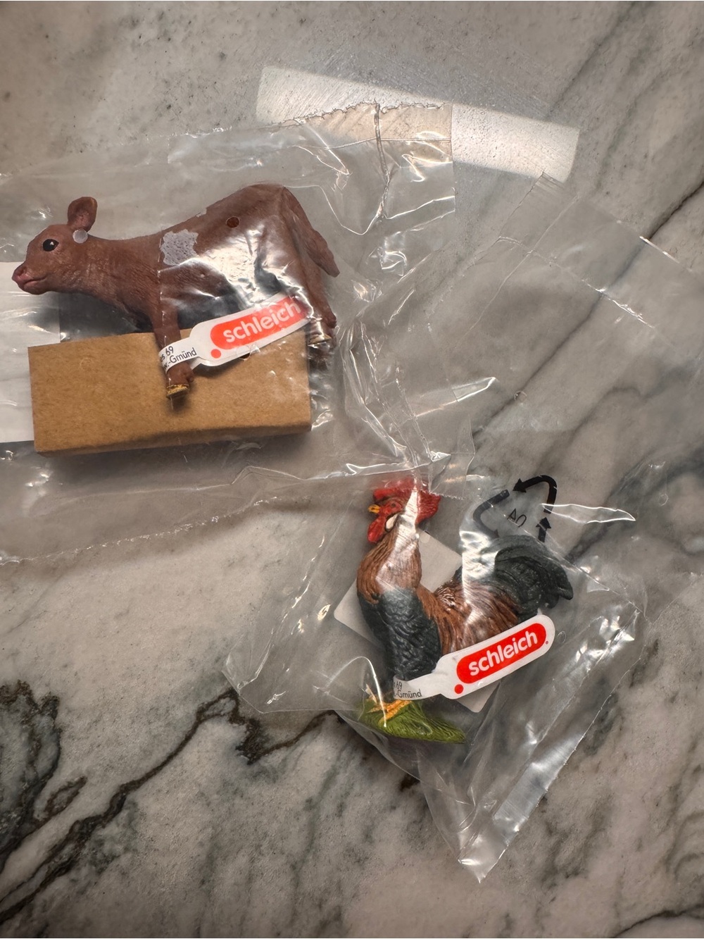Schleich longhorn calf and rooster